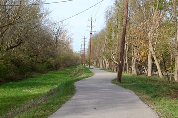 The winding sidewalk in the countryside park.