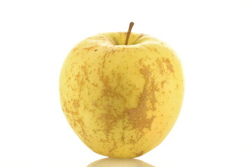 One fresh yellow apple, close-up, isolated on white.