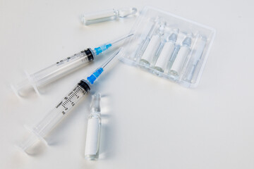 view of syringe with vaccine ampoules