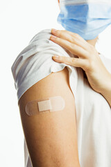 making injection of vaccine in shoulder white background