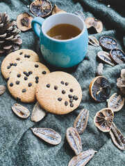 Cup of tea, cookies and dry fruit 