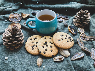 Cup of tea, cookies and dry fruit 
