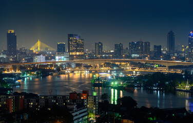Fototapeta na wymiar Night view of Bangkok city and Bangkok Bridge over Chao Phraya River