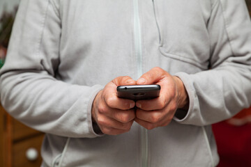 Hands using a smartphone