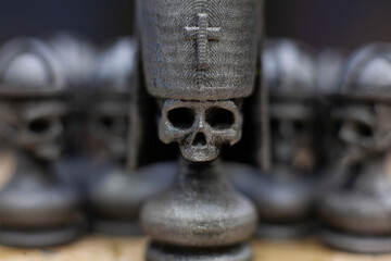 black skeleton of death chess king on a chessboard