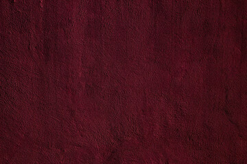 Crimson colored wall background with textures of different shades of crimson red