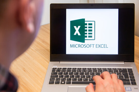 Excel is used by a man on the laptop. Microsoft customer used computer software. New product is tested by IT specialist. San Francisco, February 2020.