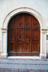 Fototapeta na wymiar Italian retro wood style front door, element of the classic facade