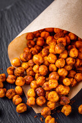 fried chickpeas on a dark stone background