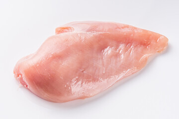raw chicken fillet on a white acrylic background