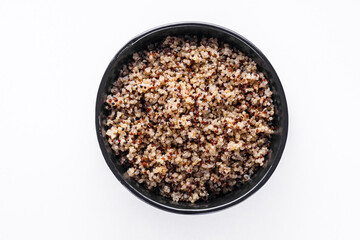 Obraz na płótnie Canvas bowl of healthy quinoa on a white acrylic background