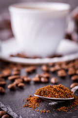 cup of fragrant fresh coffee on a dark stone background