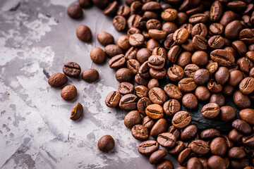 aromatic fresh coffee beans on a dark stone background