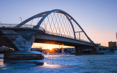 Lowry Avenue Bridge at sunset with Minneapolis Skyline behind	
