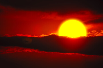 Dramatic sky with big sun . Majestic evening heaven 
