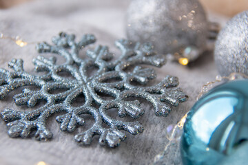 Silver christmas ornaments. 
There are a lot of lights on at Christmas.