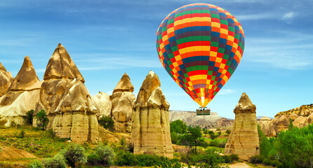 Colorful hot-air balloons flying over the mountain. © Emoji Smileys People