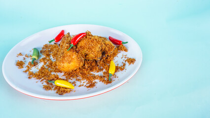 Delicious Ayam Serundeng, Chicken fried with Indonesian relish of grated coconut and spices