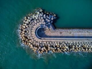 Breakwater made of concrete blocks in Luanco, Spain.