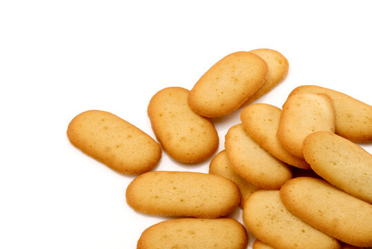 Cat Tongue cookies, called lingue di gatto in Italian pastry, on white background top view