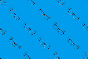 Background on the theme of glasses. Black glasses seamless pattern on a blue background.
