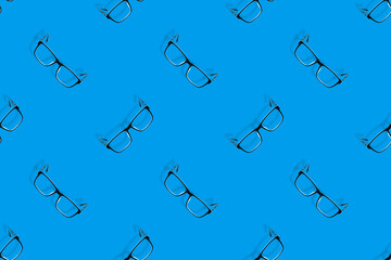 Background on the theme of glasses. Black glasses seamless pattern on a blue background.