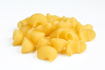 Portion of uncooked pasta snails isolated on white background. 
Dry Italian rigate dish