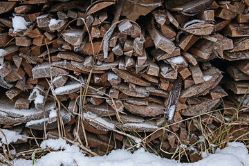 prepared firewood in the snow large