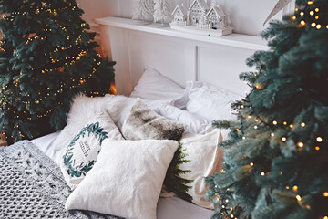 Cozy sleeping room decorated with christmas details  