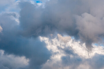 Fototapeta na wymiar Beautiful cumulus clouds of different colors in the sky