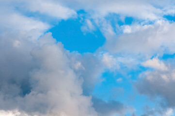 Beautiful cumulus clouds of different colors in the sky