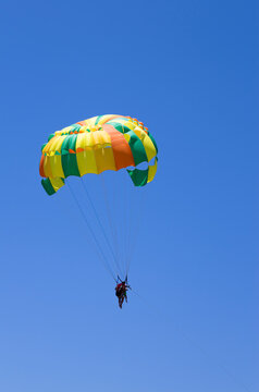 Parasailing in the blue sky
