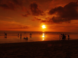 Tropical sunset in the orange sky of Kuta beach, Bali, Indonesia 