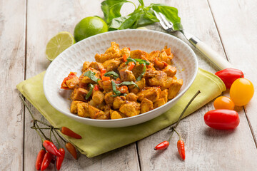 chicken stewed with tomatoes and red hot chili pepper