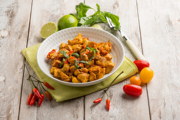 chicken stewed with tomatoes and red hot chili pepper