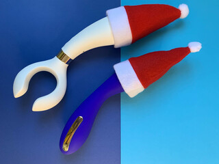 Sex toys. New year. Two vibrators on a blue background. Useful for adult, sex shop