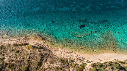 Top view aerial image from drone of an stunning beautiful sea landscape beach with turquoise water with copy space for your text.Beautiful Sand beach with turquoise water. Cesme Izmir Turkey