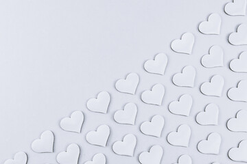 Hearts on a gray background.

Abstract background with diagonal lines on the right with space for text on the left, top view close-up.