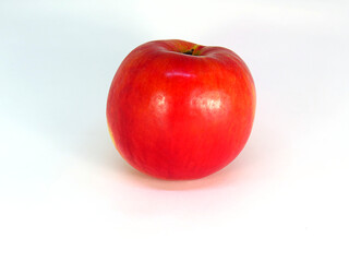Delicious and bright red apple on a white background. 