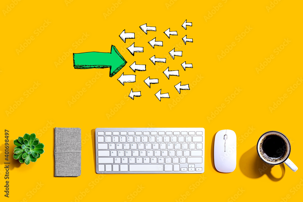 Poster arrow going in the opposite direction with a computer keyboard and a mouse