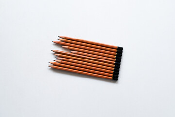 organized drawing pencil set on white background. home hobbies during quarantine and lockdown. different sizes of charcoal pencils. copy space for text. top view photo. 