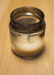 A macro closeup of a crunchy vintage candle on the table