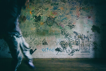 Wallpaper background of a step detail of a man dancing hip hop with red converse all star in a worn wood floor.