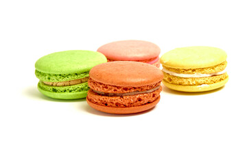 Delicious multicolored macaroons on white background.