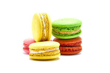 Delicious multicolored macaroons on white background.