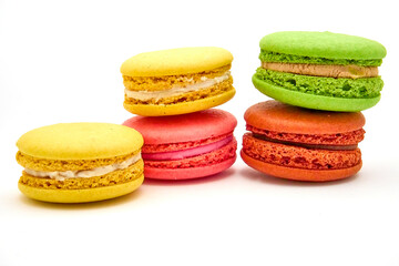 Delicious multicolored macaroons on white background.