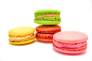 Delicious multicolored macaroons on white background.
