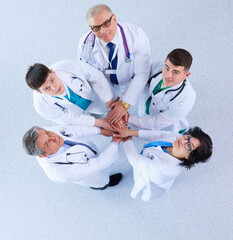 Medical team sitting and discussing at table, top view