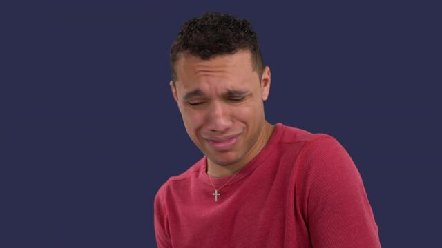 Curious multiethnic man nauseated by a disgusting smell gags and coughs