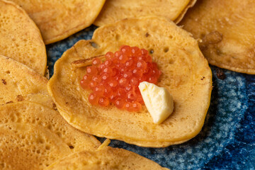 Russian pancakes with red caviar